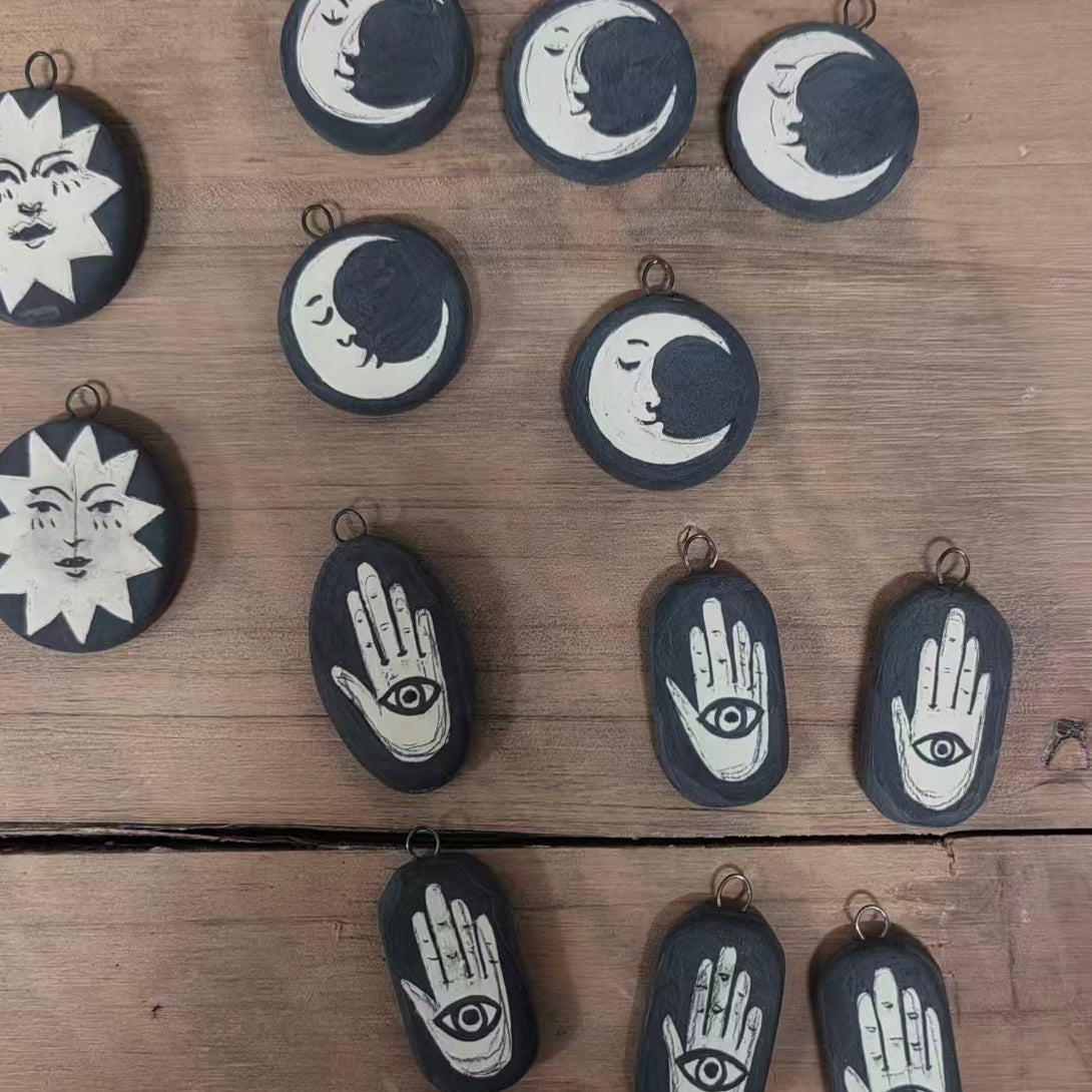 Handmade ceramic necklace, black ceramic pendant series, natural boho style, rustic nature-inspired design.