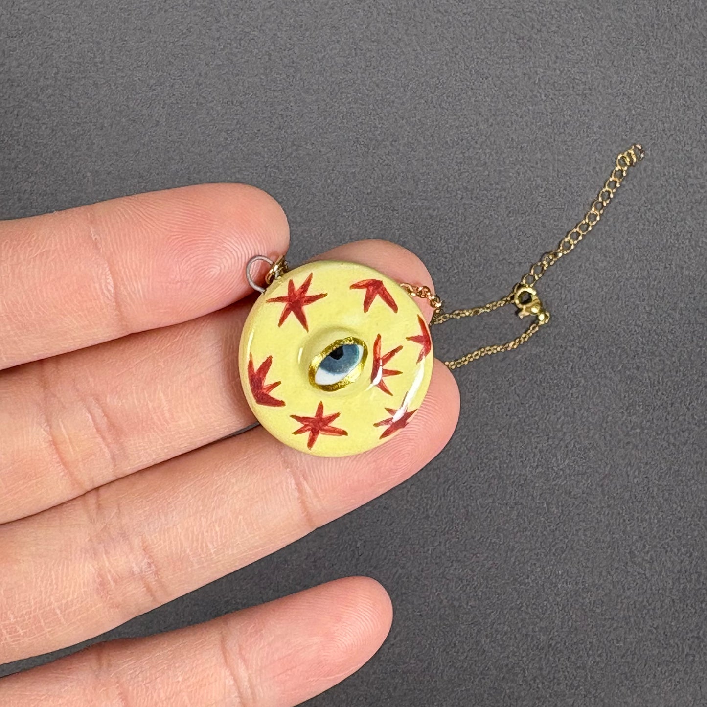 Handmade ceramic necklace, Evil Eye ceramic pendant series, natural boho style, rustic nature-inspired design.