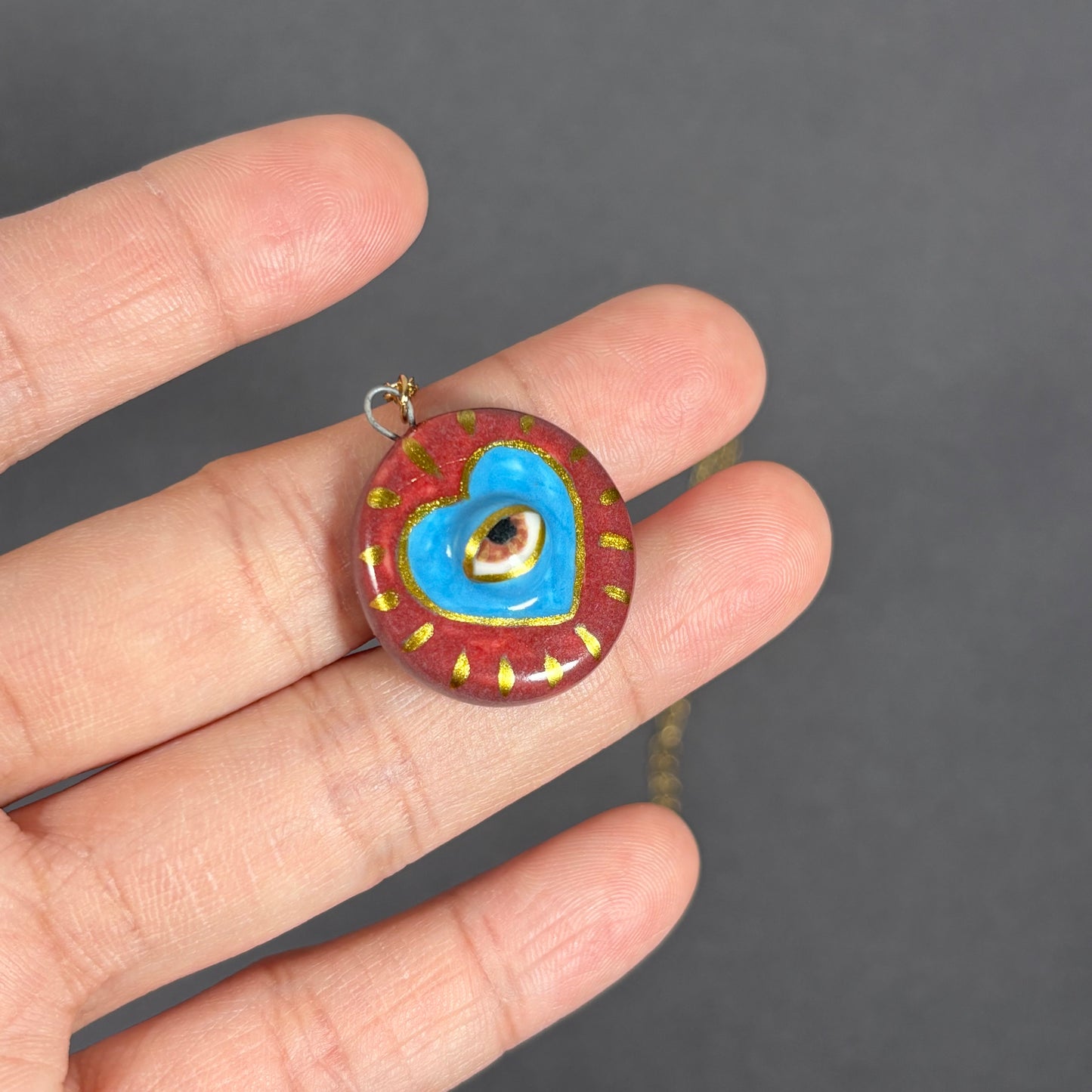 Handmade ceramic necklace, Evil Eye ceramic pendant series, natural boho style, rustic nature-inspired design.