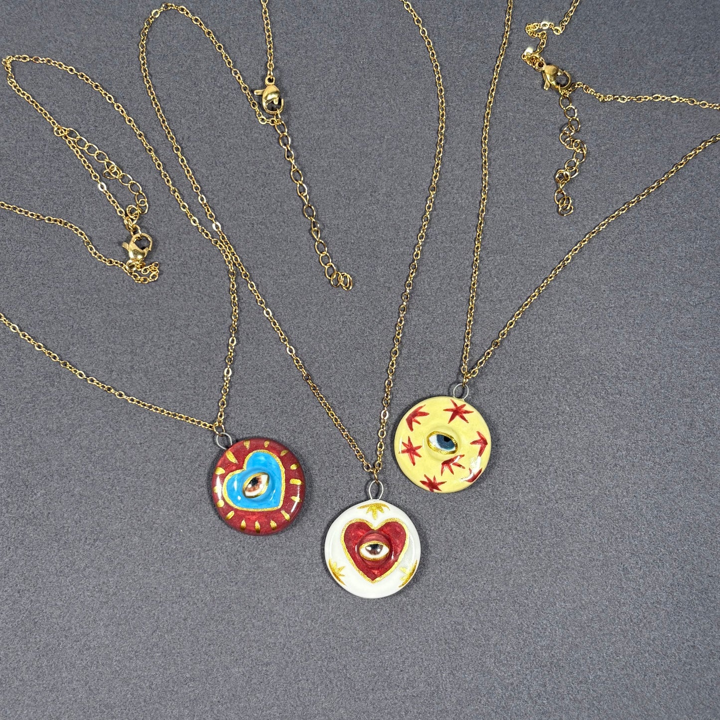 Handmade ceramic necklace, Evil Eye ceramic pendant series, natural boho style, rustic nature-inspired design.