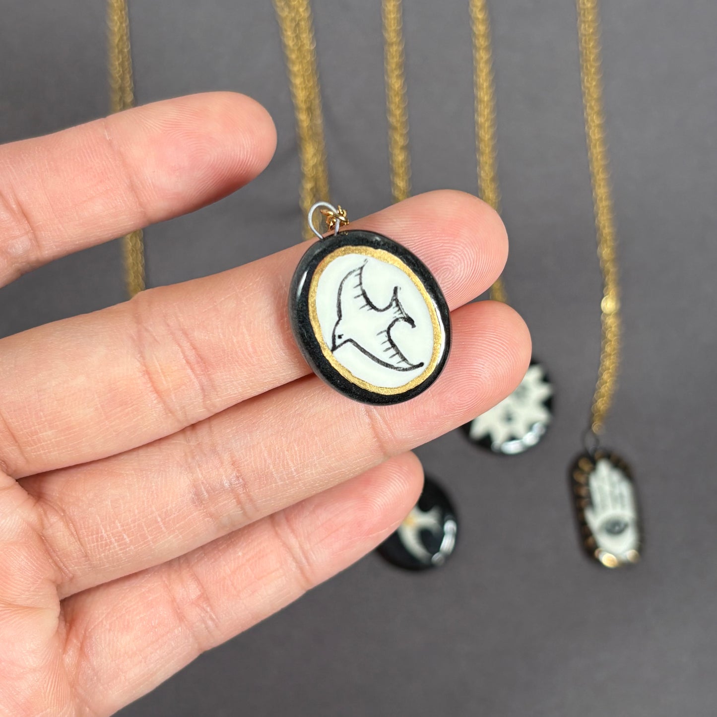 Handmade ceramic necklace, black ceramic pendant series, natural boho style, rustic nature-inspired design.