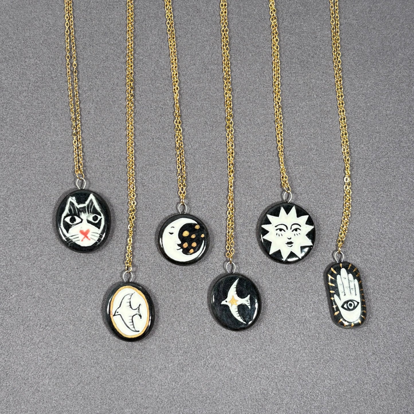 Handmade ceramic necklace, black ceramic pendant series, natural boho style, rustic nature-inspired design.