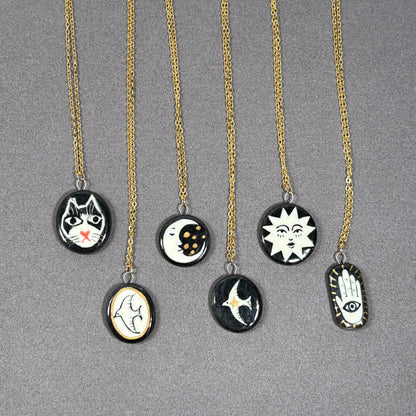 Handmade ceramic necklace, black ceramic pendant series, natural boho style, rustic nature-inspired design.