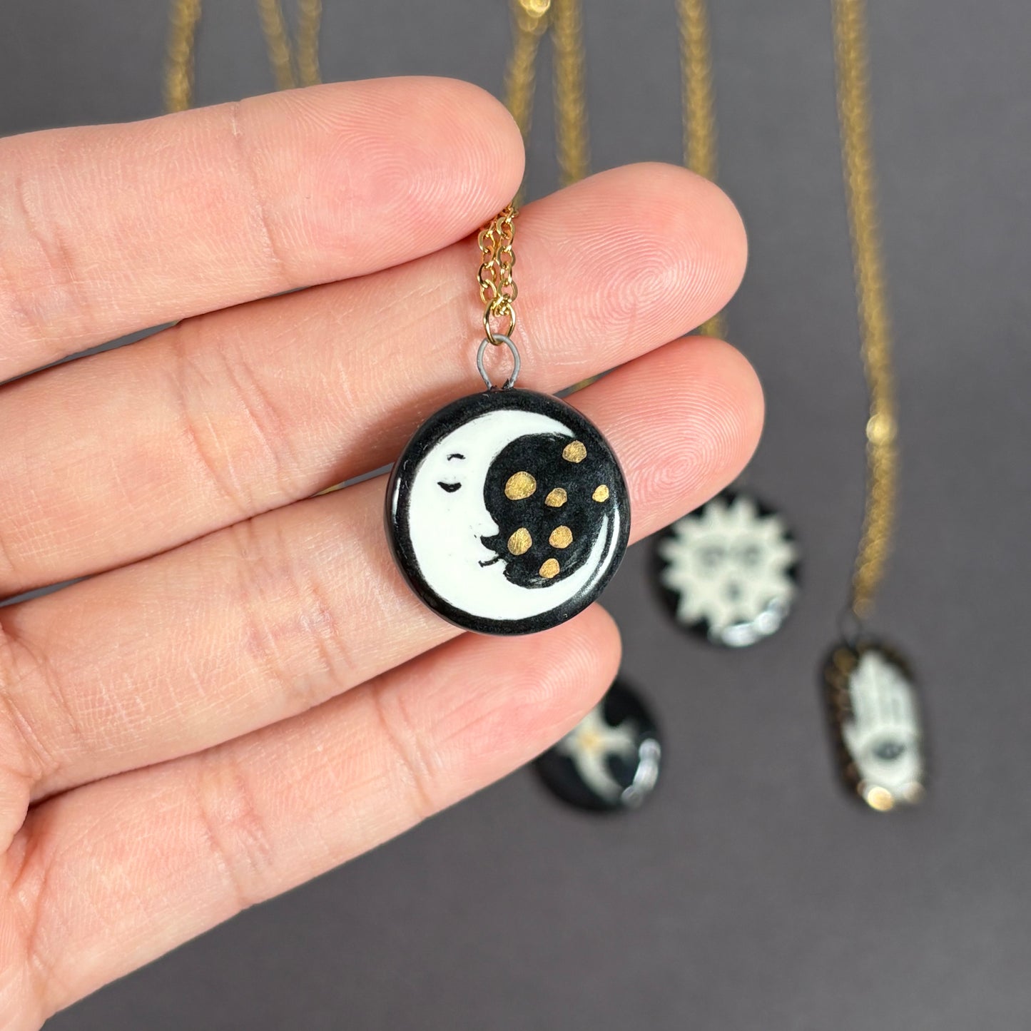 Handmade ceramic necklace, black ceramic pendant series, natural boho style, rustic nature-inspired design.