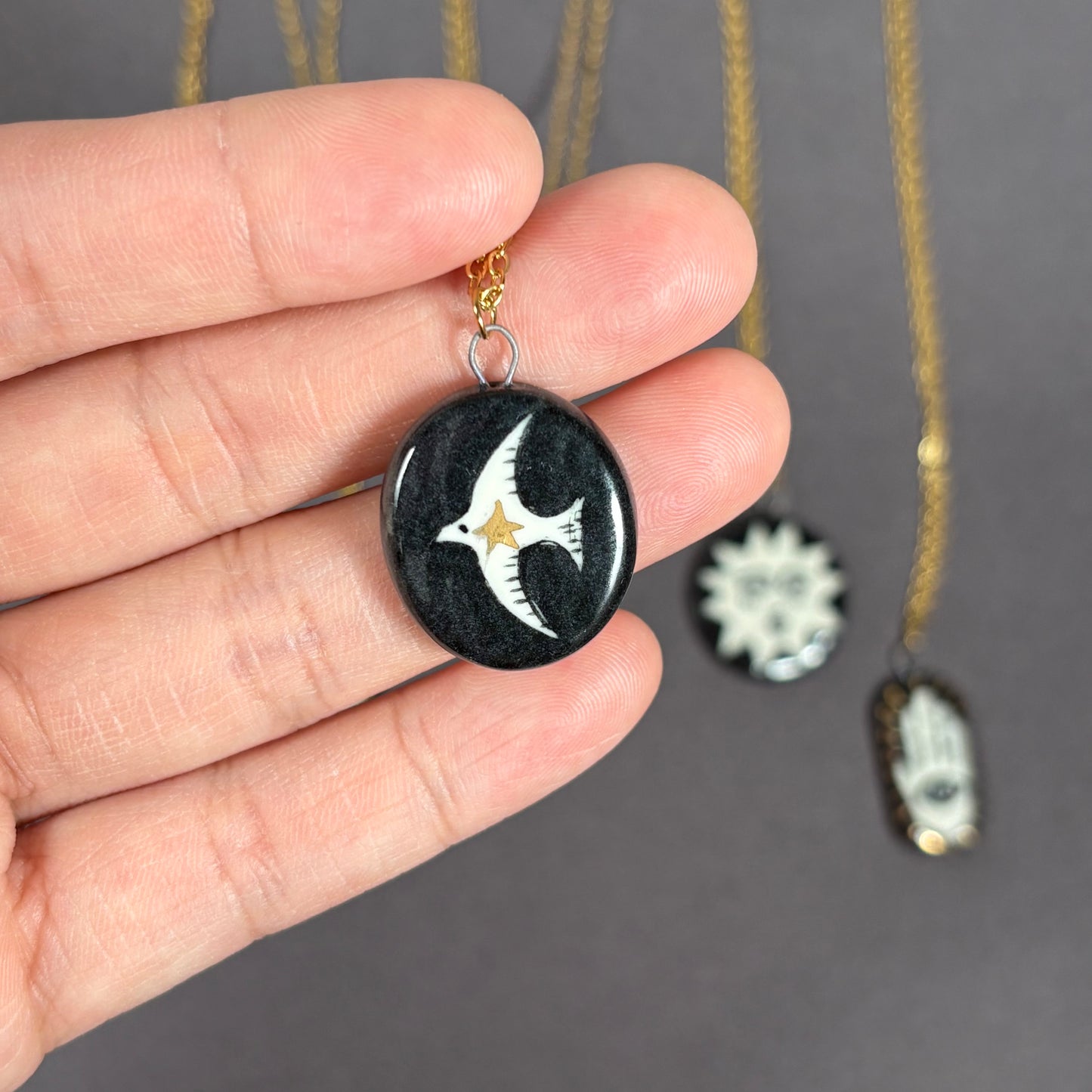 Handmade ceramic necklace, black ceramic pendant series, natural boho style, rustic nature-inspired design.