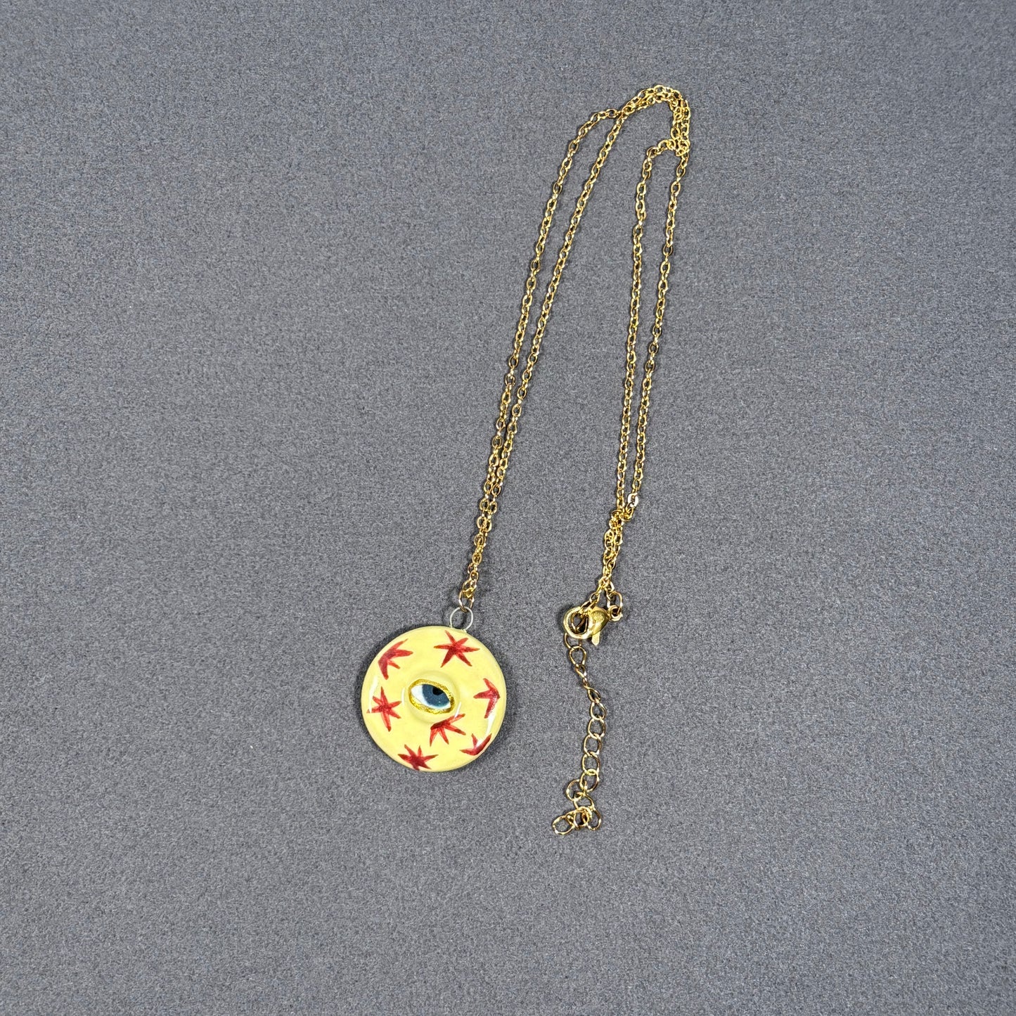 Handmade ceramic necklace, Evil Eye ceramic pendant series, natural boho style, rustic nature-inspired design.