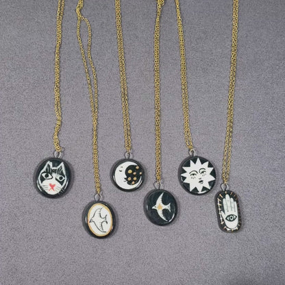 Handmade ceramic necklace, black ceramic pendant series, natural boho style, rustic nature-inspired design.